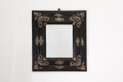 Lot 106 - An ebonised fruitwood mirror