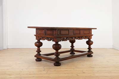 Lot 483 - A walnut centre table