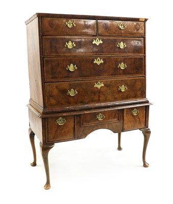 Lot 435 - A figured walnut chest on stand