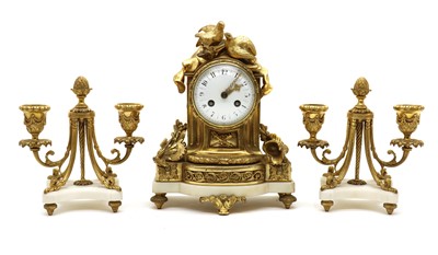 Lot 219 - A French gilt metal and marble clock garniture