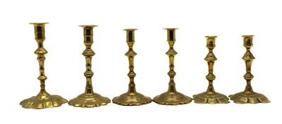 Lot 346 - Two pairs of Georgian brass candlesticks