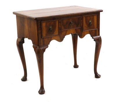 Lot 399 - A Georgian walnut and yewood lowboy