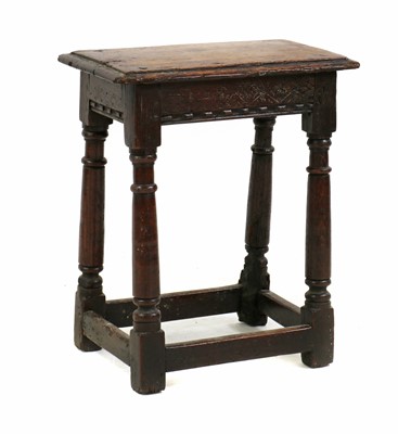 Lot 353 - An oak joint stool