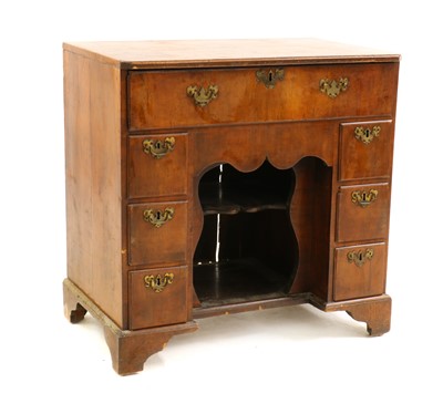Lot 308 - A walnut kneehole desk