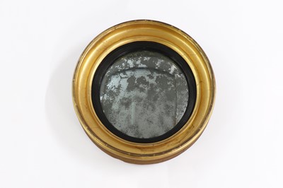 Lot 122 - A Regency gilt-framed convex wall mirror