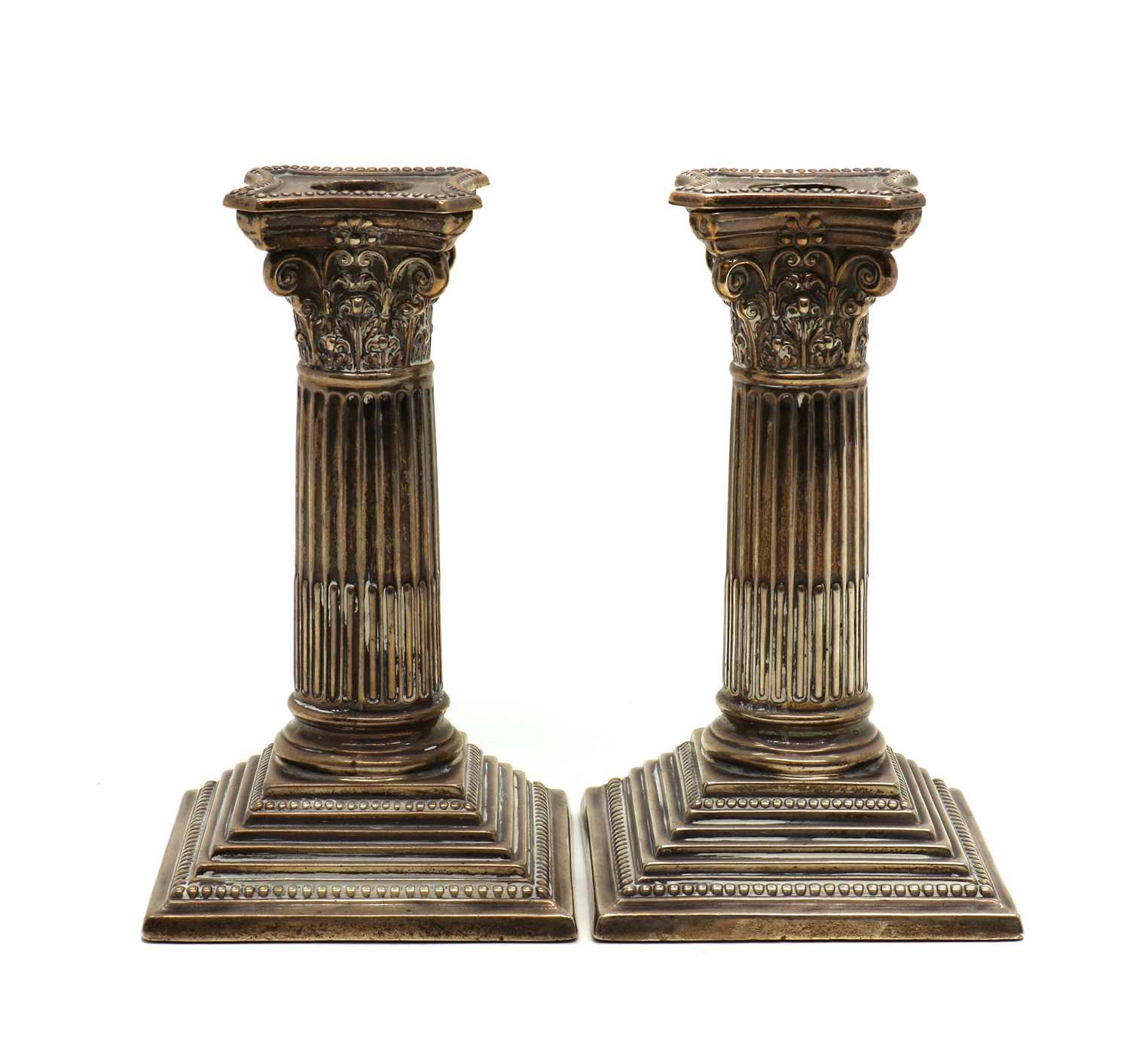 Lot 34 - A pair of Edwardian silver candlesticks