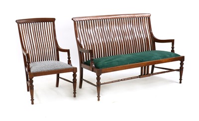 Lot 400 - An Arts and Crafts mahogany settee and armchair