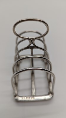 Lot 19 - A Victorian silver four division toast rack