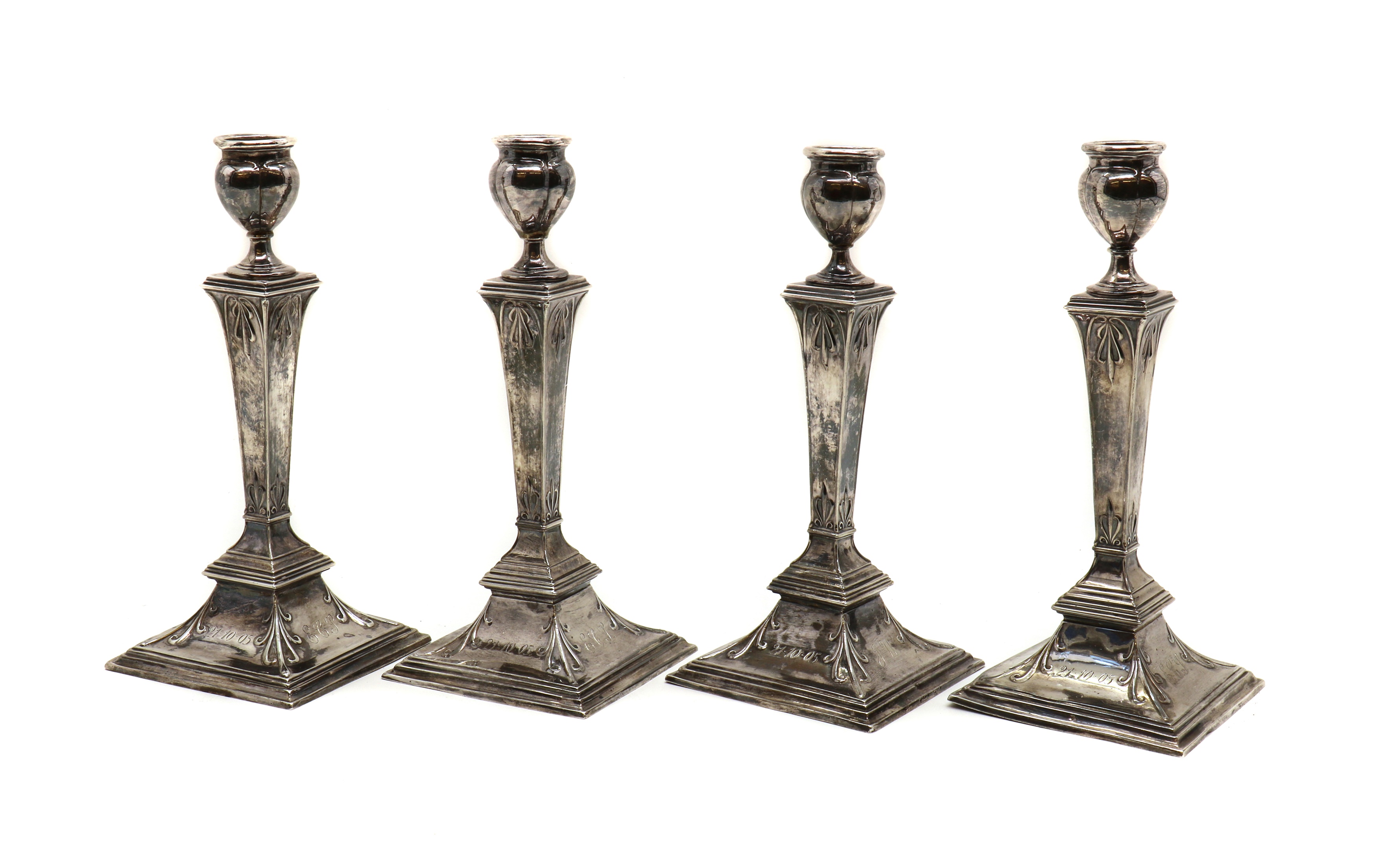 Lot 2 A set of four silver candlesticks
