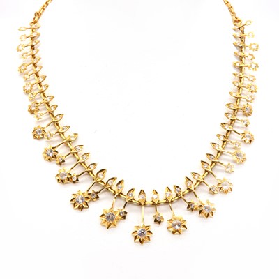 Lot 404 - A high carat gold synthetic white spinel and synthetic white sapphire set fringe necklace