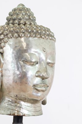 Lot 211 - A large cast metal head of Buddha