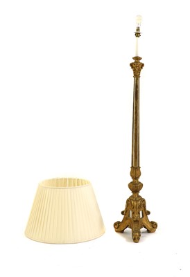 Lot 459 - A giltwood and mirrored glass standard lamp