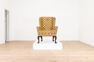 Lot 383 - A Queen Anne walnut wingback armchair