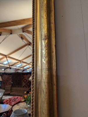 Lot 299 - A large giltwood overmantel mirror