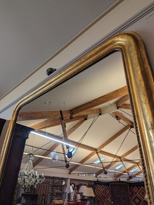 Lot 299 - A large giltwood overmantel mirror