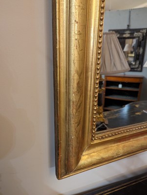 Lot 299 - A large giltwood overmantel mirror