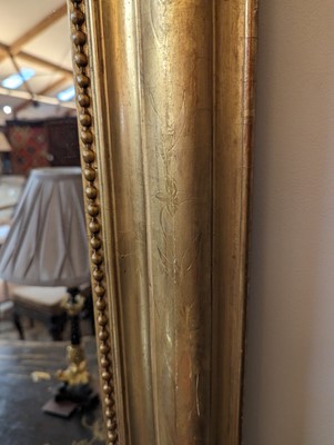 Lot 299 - A large giltwood overmantel mirror