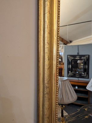 Lot 299 - A large giltwood overmantel mirror