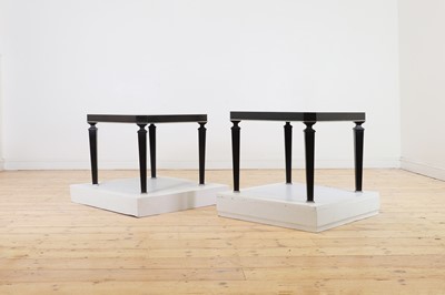Lot 301 - A pair of ebonised occasional tables