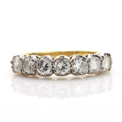 Lot 203 - An 18ct gold seven stone diamond half eternity ring, by Garrard & Co., c.1980