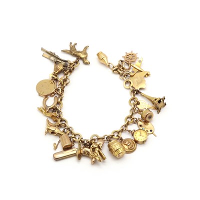 Lot 176 - A gold charm bracelet