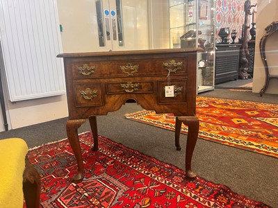 Lot 55 - A walnut lowboy