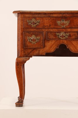 Lot 55 - A walnut lowboy