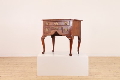 Lot 55 - A walnut lowboy