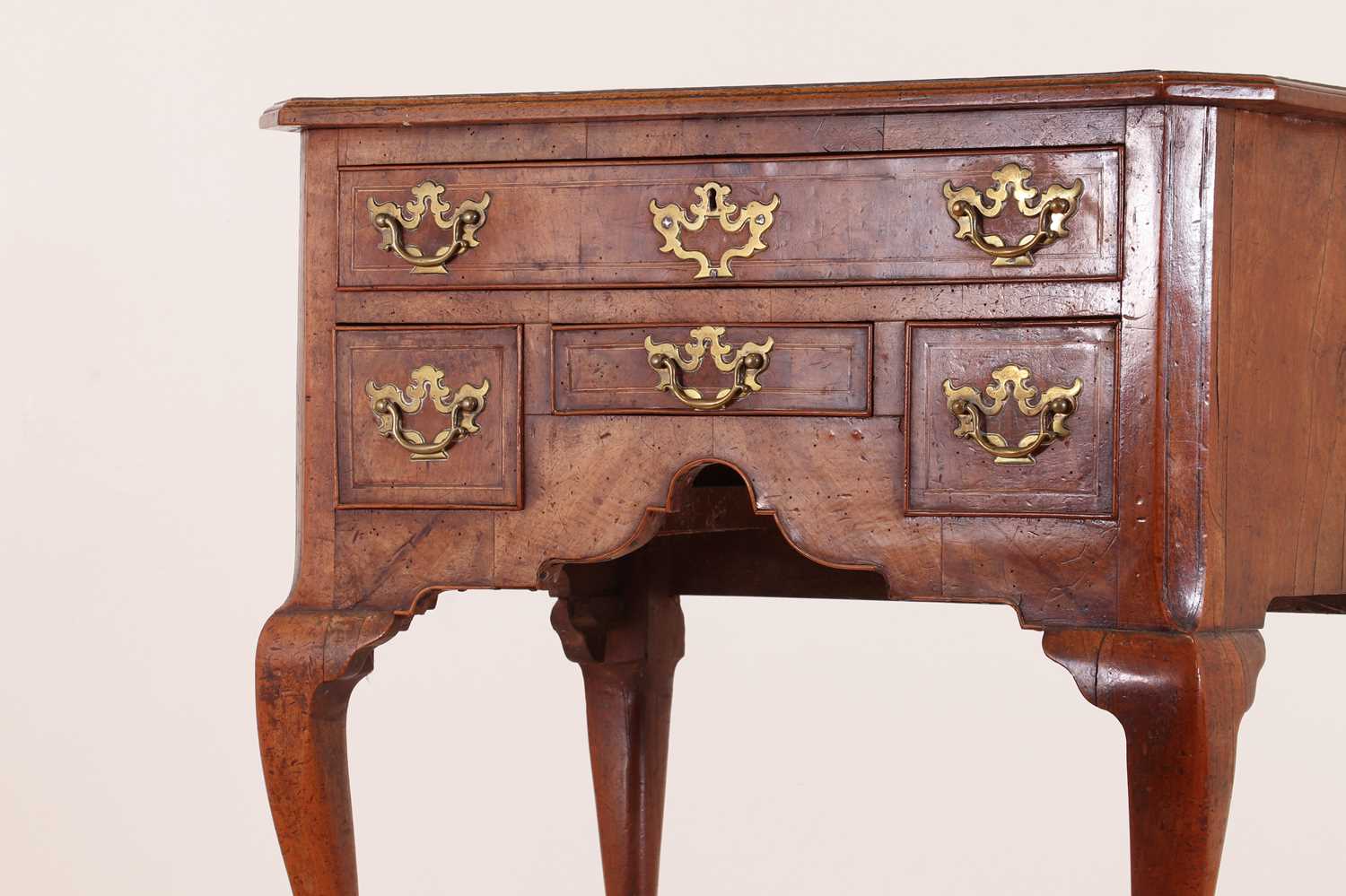 Lot 55 - A walnut lowboy