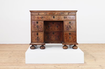 Lot 353 - A Queen Anne walnut kneehole desk
