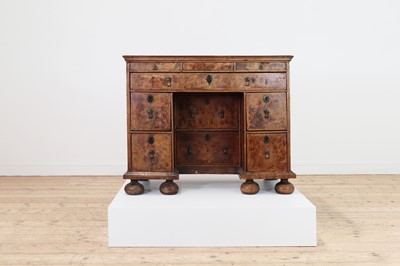 Lot 353 - A Queen Anne walnut kneehole desk