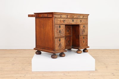 Lot 353 - A Queen Anne walnut kneehole desk