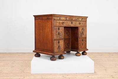 Lot 353 - A Queen Anne walnut kneehole desk