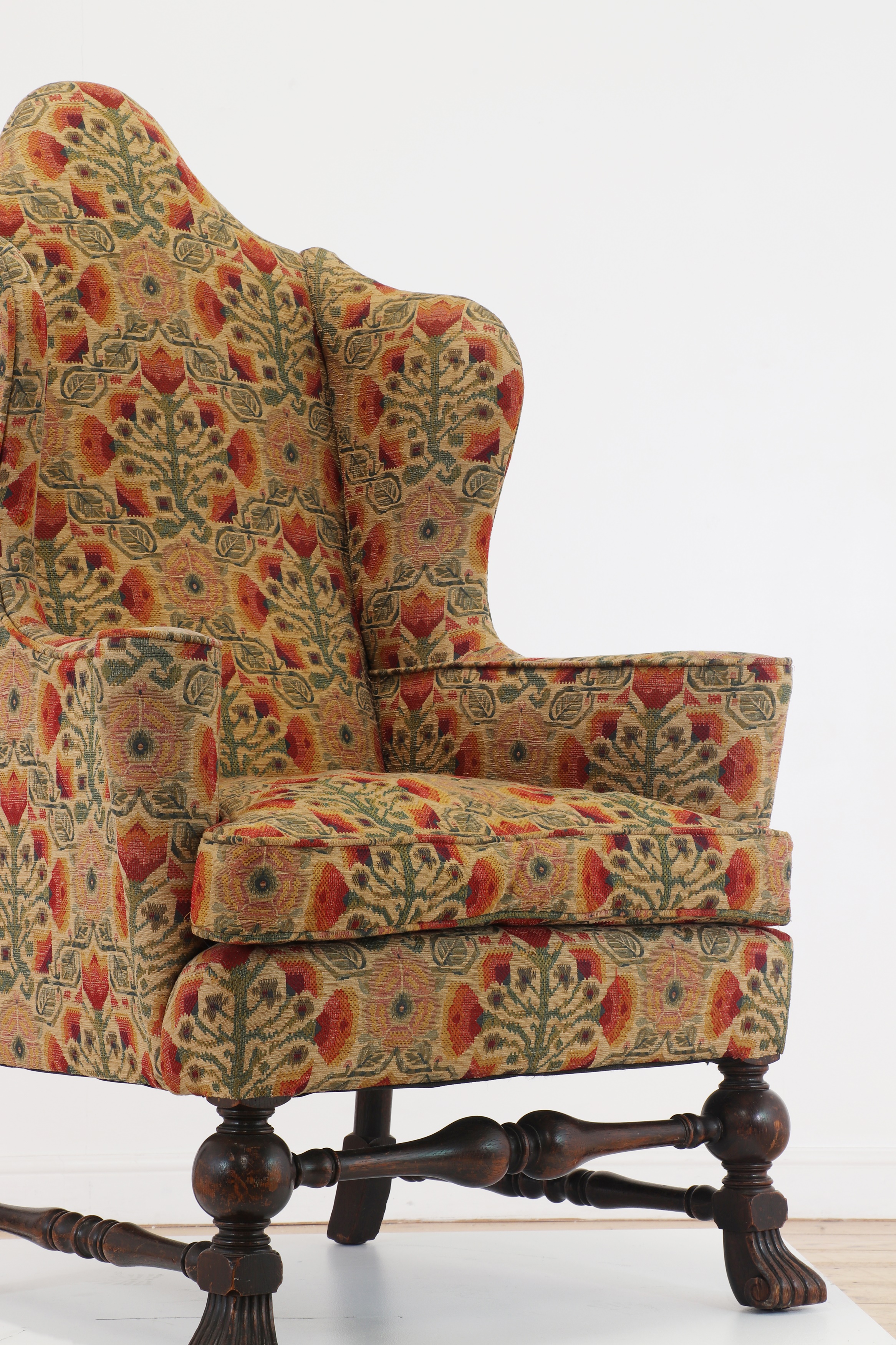 A William and Mary-style walnut wingback armchair
