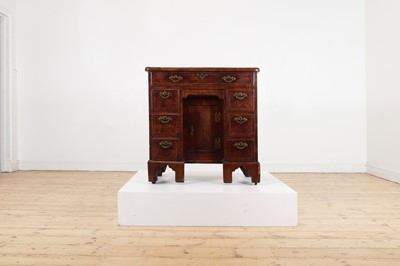 Lot 34 - A George II walnut and feather-banded kneehole desk