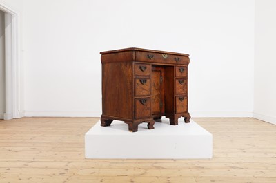 Lot 387 - A George I walnut and feather-banded kneehole desk