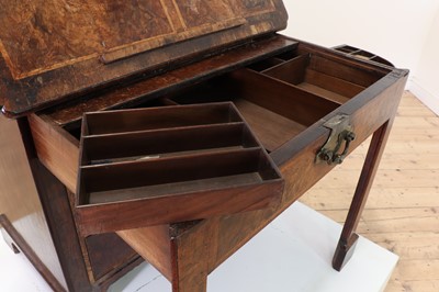 Lot 345 - A George I walnut and feather-banded architect's desk
