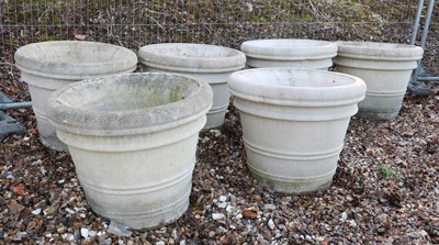 Lot 487 - A set of six large reconstituted stone garden urns