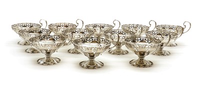 Lot 44 - A set of twelve silver footed dessert dishes
