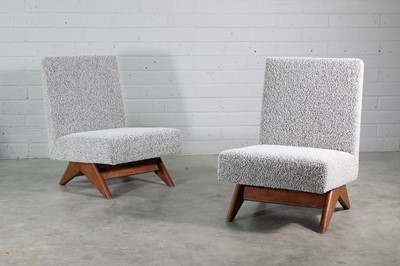Lot 317 - A pair of teak 'Compass' armchairs
