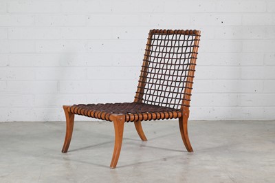 Lot 264 - A 'Klismos' walnut lounge chair