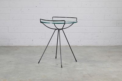 Lot 431 - An iron and glass side table