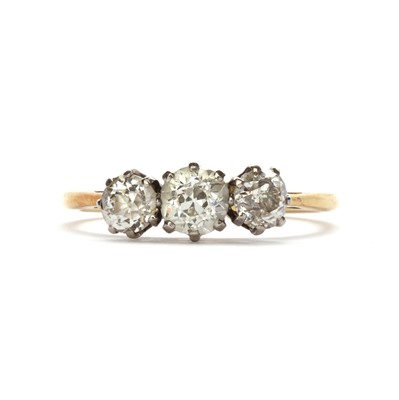 Lot 66 - A gold three stone diamond ring