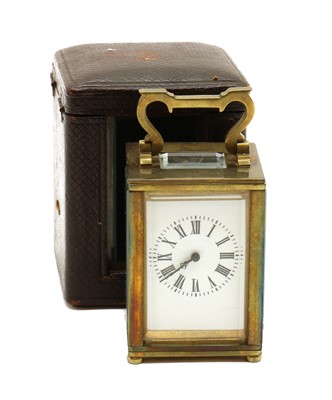 Lot 292 - A miniature brass carriage timepiece