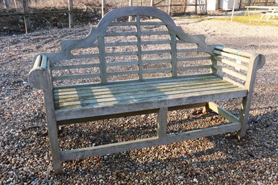 Lot 490 - A teak Lutyens style garden seat