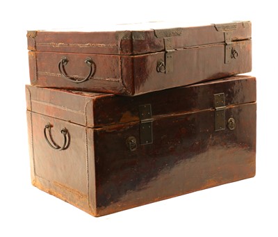 Lot 240 - A collection of four Chinese lacquered leather trunks