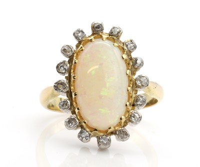 Lot 337 - An opal and diamond oval cluster ring