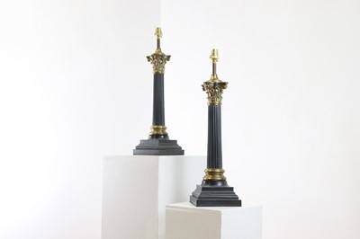 Lot 469 - A pair of patinated and gilt-metal column table lamps