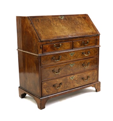 Lot 375 - A George II figured walnut bureau