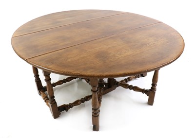 Lot 460 - An old reproduction oak gateleg table